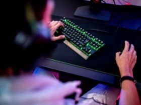 a person is typing on a computer keyboard